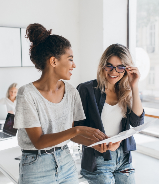 two women working together